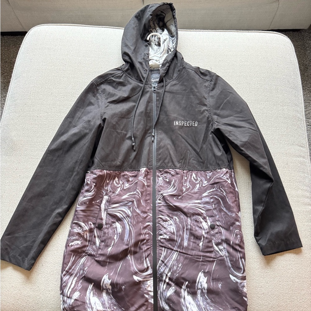 Black and Marble Pattern ‘Inspected’ Rain Coat